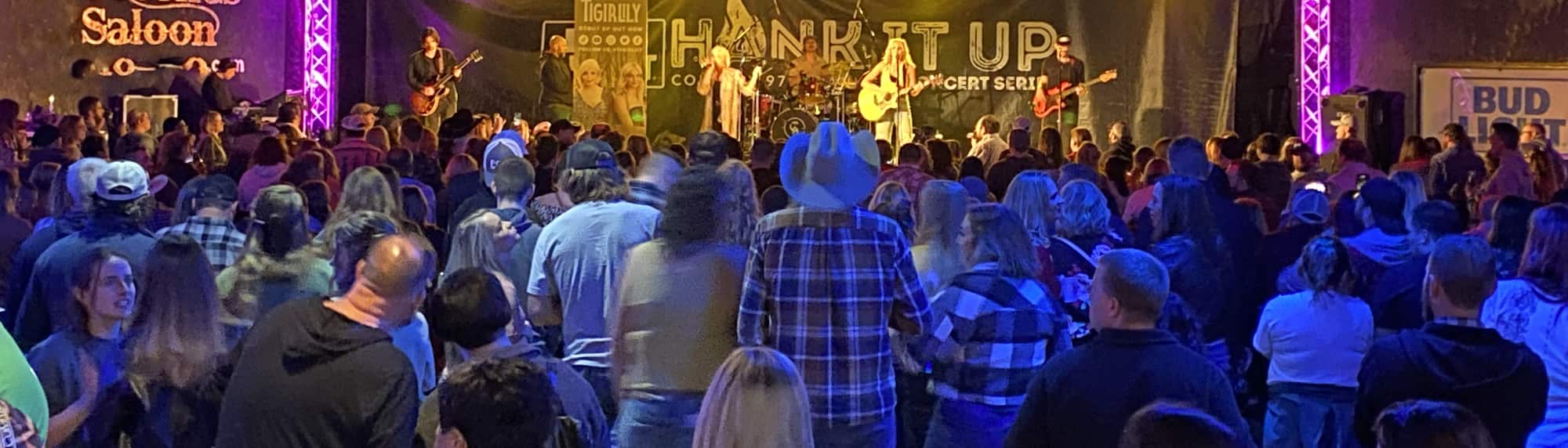 country concert with fans wearing cowboy hats Portland